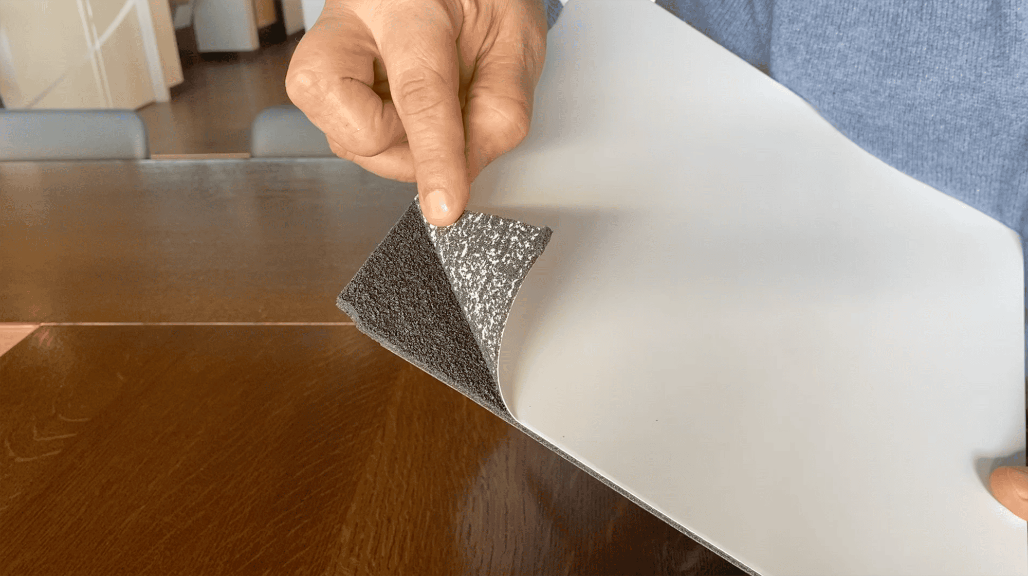 Styrene Based Foam Board Sample Being Peeled Back To Reveal Inside Material